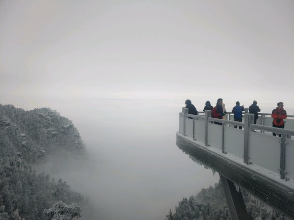 戴好帽子赏雪景庐山